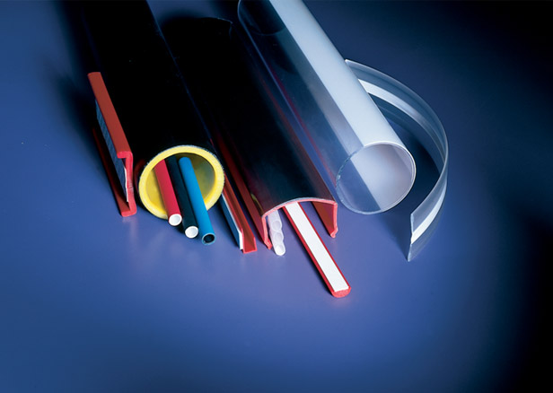 Pile of multicolored co-extruded tubes and profiles