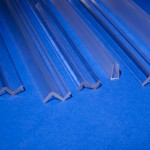 Clear plastic profiles resting on blue background